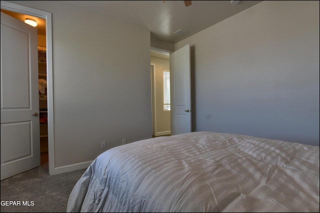 bedroom with carpet floors and baseboards