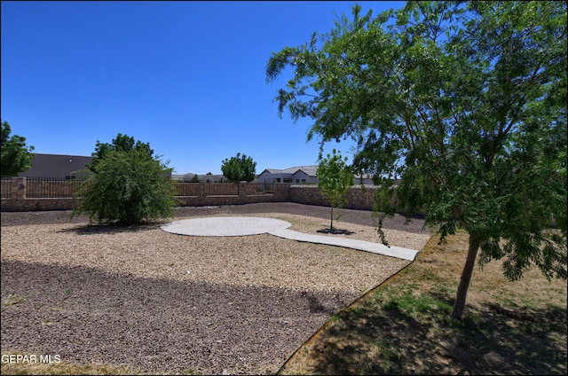 view of yard featuring a patio and a fenced backyard