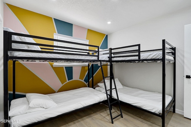 bedroom featuring recessed lighting, baseboards, and wood finished floors