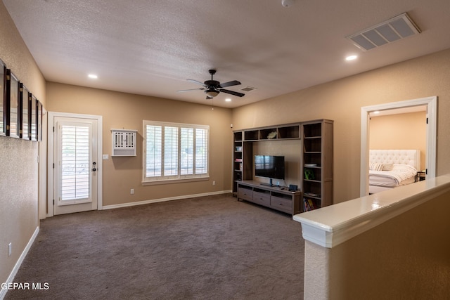 unfurnished living room featuring dark carpet, a ceiling fan, baseboards, recessed lighting, and visible vents