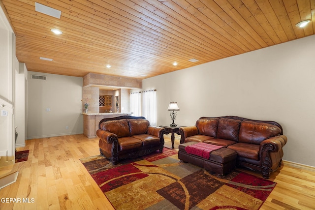 1859 Luis Gomez Place, El Paso, TX 79936 - living room featuring wood ceiling, light wood-style flooring, bar, and baseboards