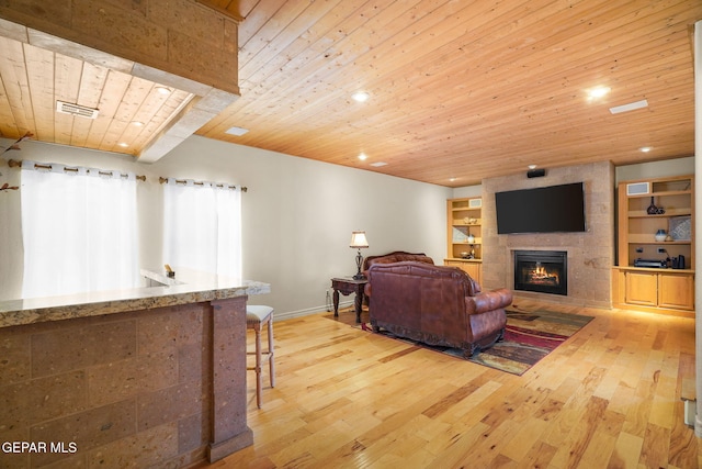 1859 Luis Gomez Place, El Paso, TX 79936 - living area featuring wood ceiling, hardwood / wood-style flooring, baseboards, a fireplace, and recessed lighting