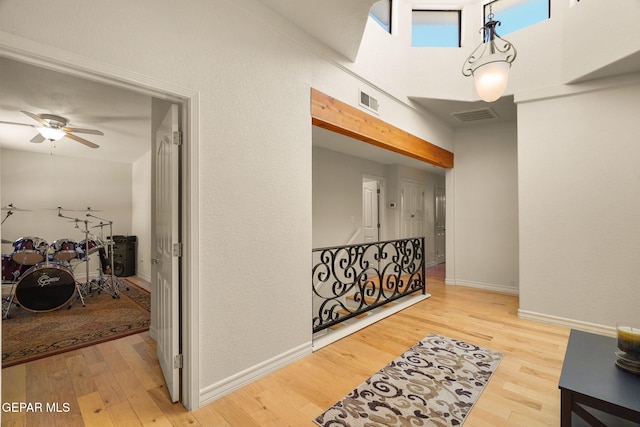 1859 Luis Gomez Place, El Paso, TX 79936 - hall featuring wood finished floors, baseboards, and a towering ceiling