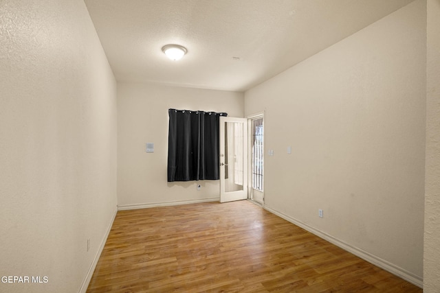 1859 Luis Gomez Place, El Paso, TX 79936 - unfurnished room with wood finished floors and baseboards