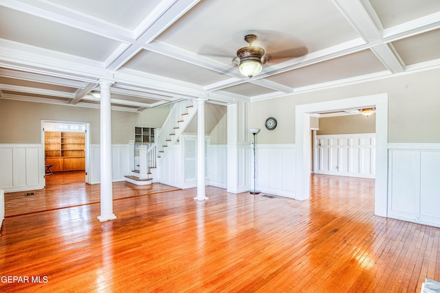 unfurnished living room with ceiling fan, decorative columns, and coffered ceiling