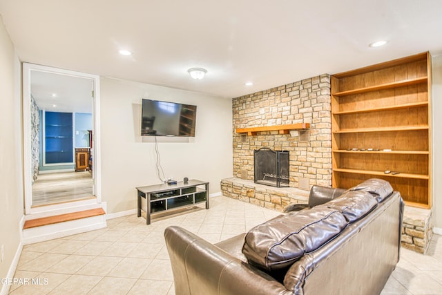 living room with baseboards, a stone fireplace, recessed lighting, and light tile patterned flooring