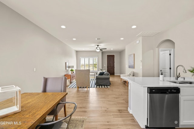 921 Raegil St, El Paso, TX 79928 - kitchen featuring dishwasher, a sink, ceiling fan, arched walkways, and white cabinets