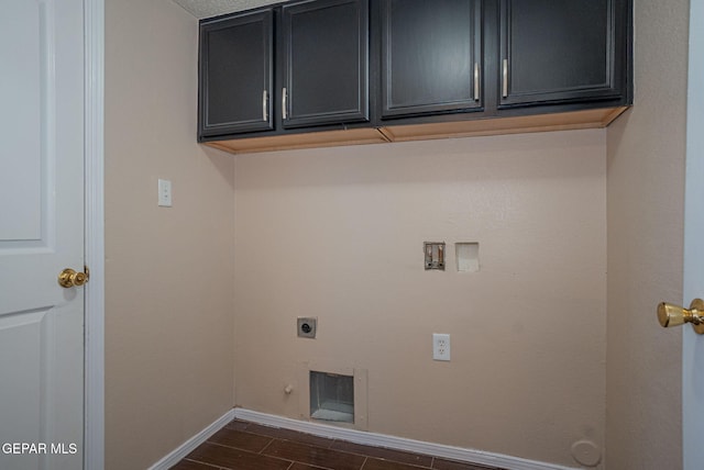527 Longleaf Pl, El Paso, TX 79928 - laundry area with cabinet space, dark wood-style flooring, hookup for a washing machine, electric dryer hookup, and baseboards