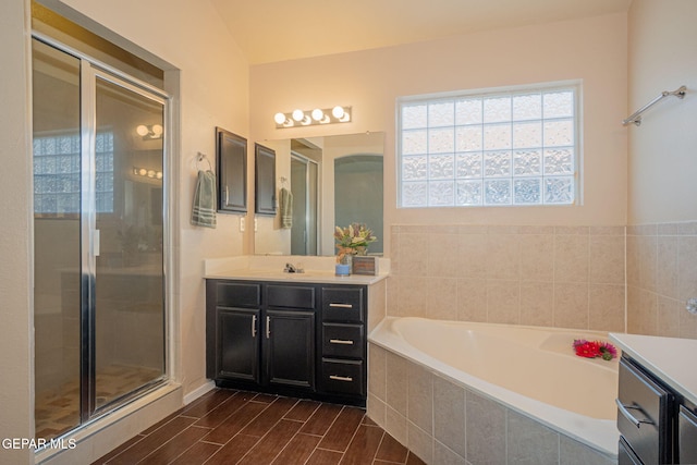 527 Longleaf Pl, El Paso, TX 79928 - bathroom with vanity, wood finished floors, a bath, and a shower stall