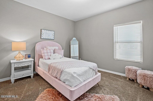 bedroom featuring carpet floors and baseboards