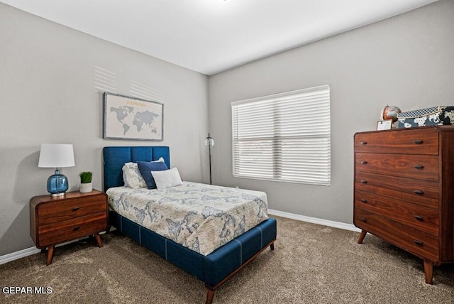carpeted bedroom featuring baseboards