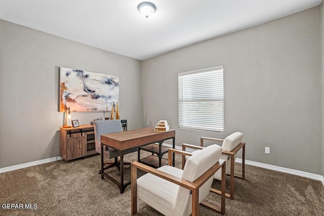 carpeted office featuring baseboards