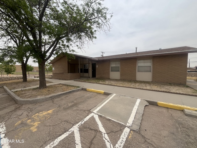 5310 Blanco Ave Unit 5310-5314, El Paso, TX 79905 - view of front facade featuring uncovered parking and brick siding