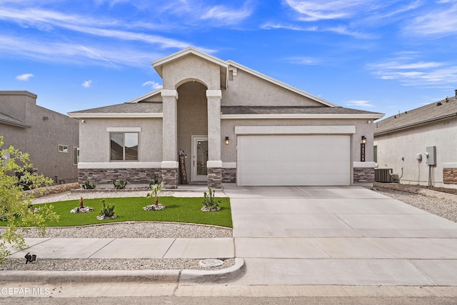 13740 Lago Vista Ave, El Paso, TX 79928 - view of front of home featuring stone siding, stucco siding, driveway, and an attached garage