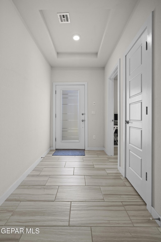13740 Lago Vista Ave, El Paso, TX 79928 - hallway with wood tiled floors, a raised ceiling, baseboards, and recessed lighting