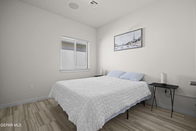 13740 Lago Vista Ave, El Paso, TX 79928 - bedroom with baseboards and wood finished floors
