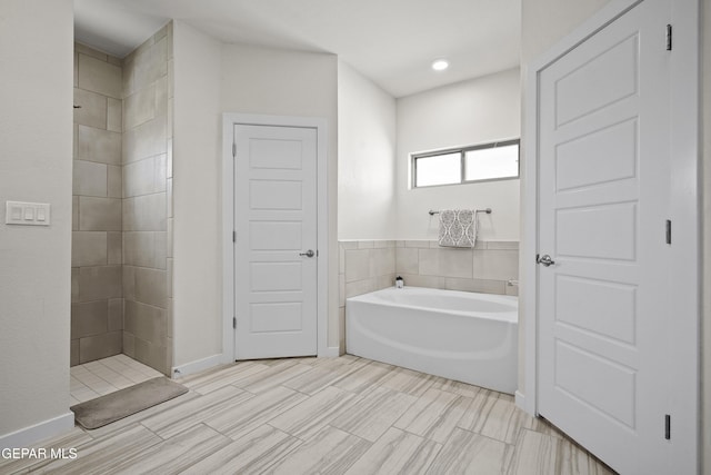 13740 Lago Vista Ave, El Paso, TX 79928 - full bath with a garden tub and a tile shower