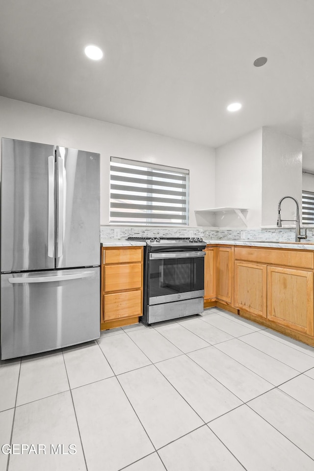 kitchen with light countertops, appliances with stainless steel finishes, and recessed lighting