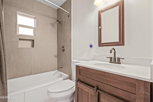 full bath featuring vanity, tub / shower combination, and toilet