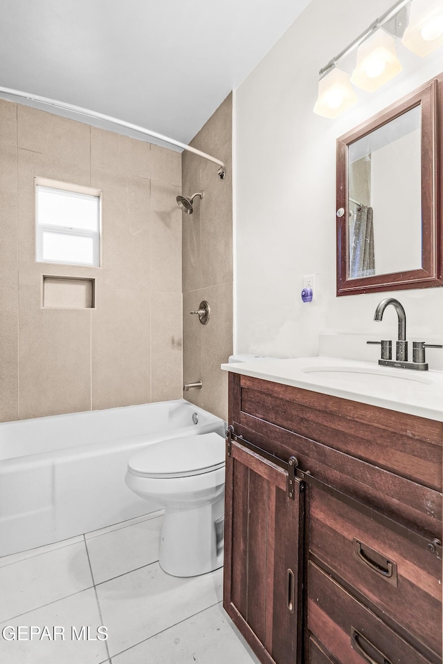 bathroom featuring tile patterned flooring, toilet, shower / bath combination with curtain, and vanity