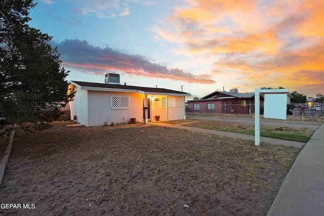 bungalow with stucco siding