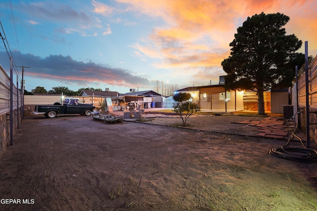 view of yard at dusk