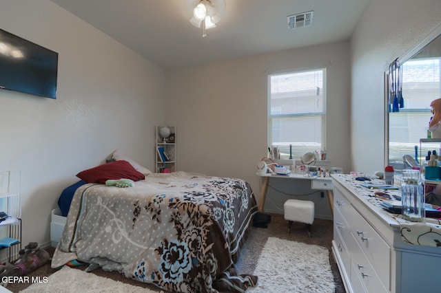 4929 Adrian Campos St, El Paso, TX 79938 - bedroom with visible vents, carpet floors, and multiple windows