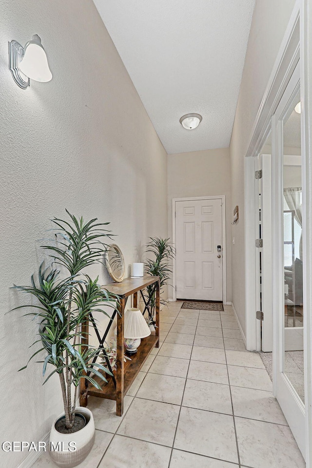 interior space with light tile patterned floors