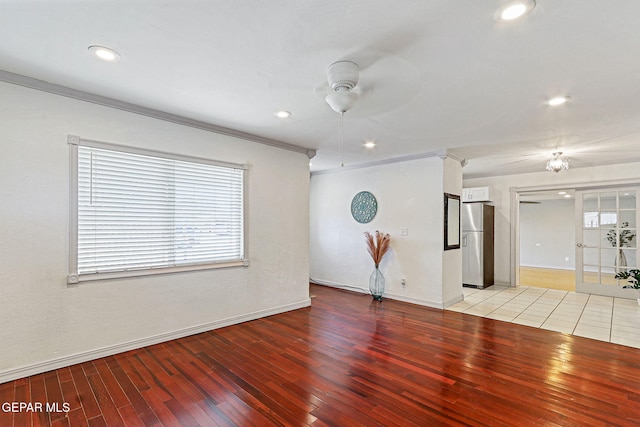 unfurnished living room with light wood-style floors, a ceiling fan, recessed lighting, and a healthy amount of sunlight