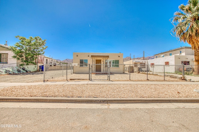 8929 Robert Dr Unit 1 & 2, El Paso, TX 79904 - view of front of property with a gate, a fenced front yard, and stucco siding