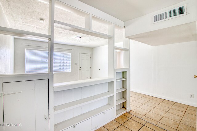 8929 Robert Dr Unit 1 & 2, El Paso, TX 79904 - spare room with visible vents, baseboards, and light tile patterned floors
