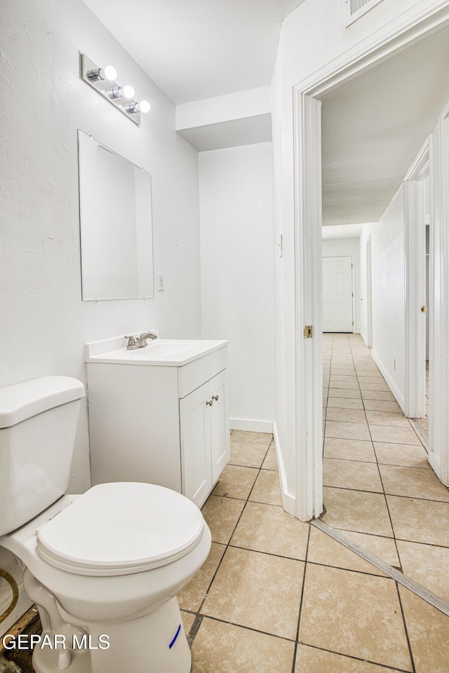 8929 Robert Dr Unit 1 & 2, El Paso, TX 79904 - bathroom featuring vanity, tile patterned floors, and toilet