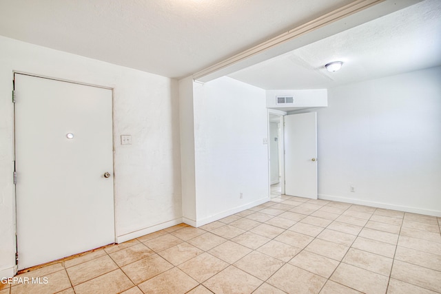 8929 Robert Dr Unit 1 & 2, El Paso, TX 79904 - spare room with light tile patterned floors, baseboards, and visible vents