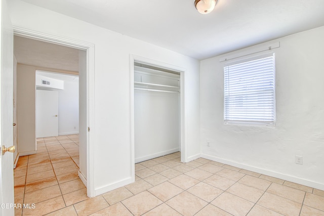 8929 Robert Dr Unit 1 & 2, El Paso, TX 79904 - unfurnished bedroom featuring light tile patterned floors, baseboards, a closet, and visible vents