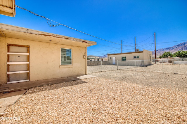 8929 Robert Dr Unit 1 & 2, El Paso, TX 79904 - view of yard with fence and a mountain view