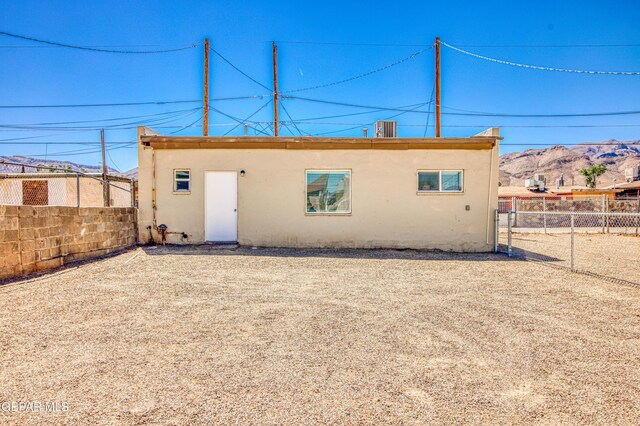 8929 Robert Dr Unit 1 & 2, El Paso, TX 79904 - back of house with a fenced backyard, central AC unit, and stucco siding