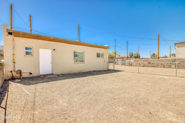 8929 Robert Dr Unit 1 & 2, El Paso, TX 79904 - rear view of house featuring a fenced backyard and stucco siding