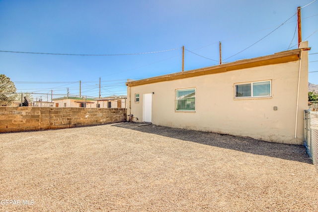 8929 Robert Dr Unit 1 & 2, El Paso, TX 79904 - rear view of property with fence and stucco siding