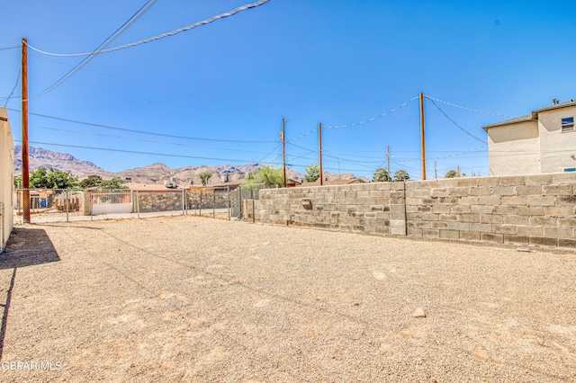 8929 Robert Dr Unit 1 & 2, El Paso, TX 79904 - view of yard featuring a mountain view and fence