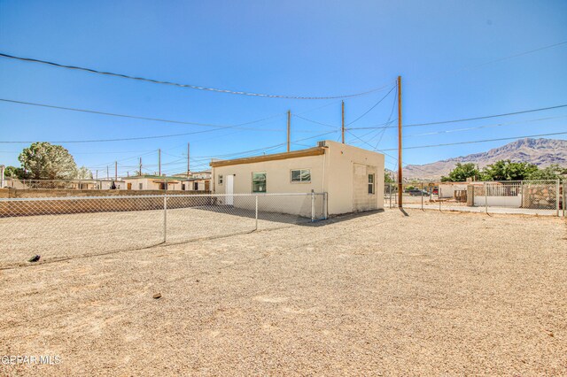 8929 Robert Dr Unit 1 & 2, El Paso, TX 79904 - exterior space featuring a mountain view, stucco siding, and fence private yard