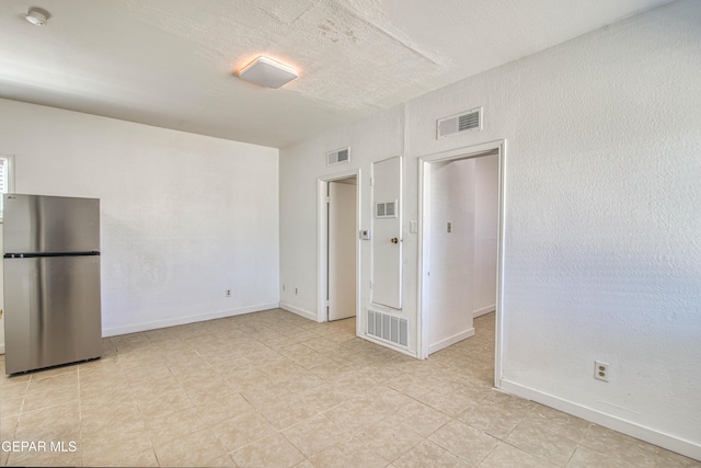 8929 Robert Dr Unit 1 & 2, El Paso, TX 79904 - spare room featuring visible vents, baseboards, and light tile patterned flooring