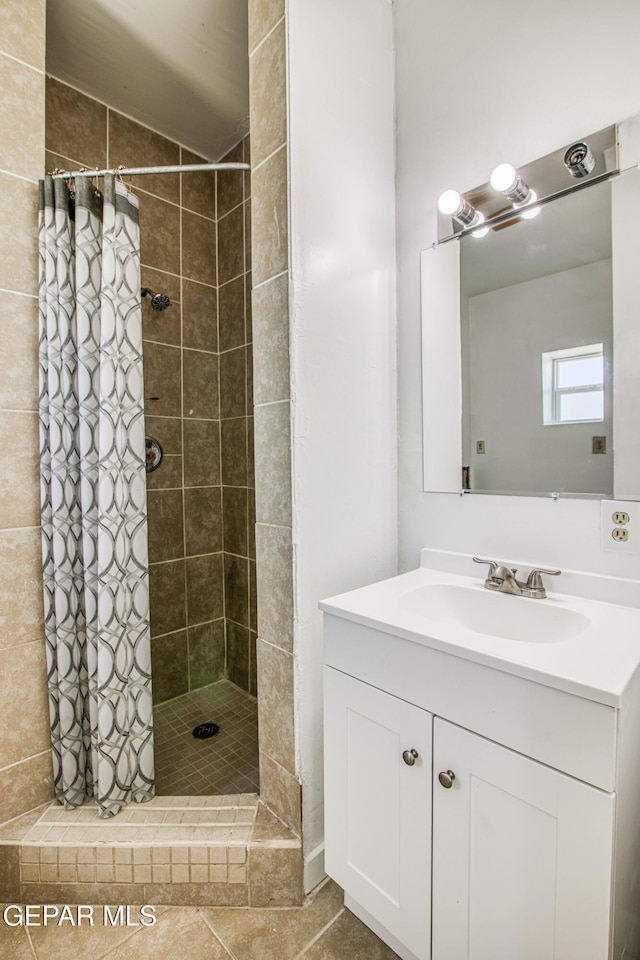 8929 Robert Dr Unit 1 & 2, El Paso, TX 79904 - bathroom featuring vanity and a stall shower