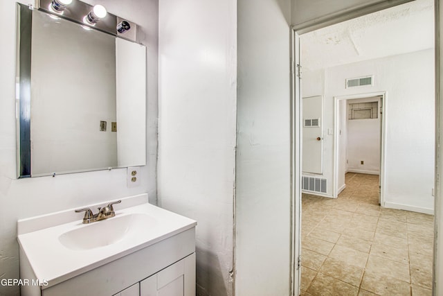 8929 Robert Dr Unit 1 & 2, El Paso, TX 79904 - bathroom featuring visible vents, tile patterned flooring, and vanity