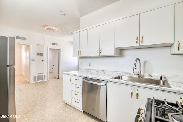 8929 Robert Dr Unit 1 & 2, El Paso, TX 79904 - kitchen featuring a sink, appliances with stainless steel finishes, and visible vents
