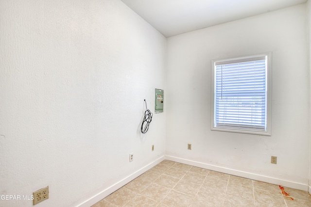 8929 Robert Dr Unit 1 & 2, El Paso, TX 79904 - unfurnished room with baseboards, plenty of natural light, and light tile patterned floors