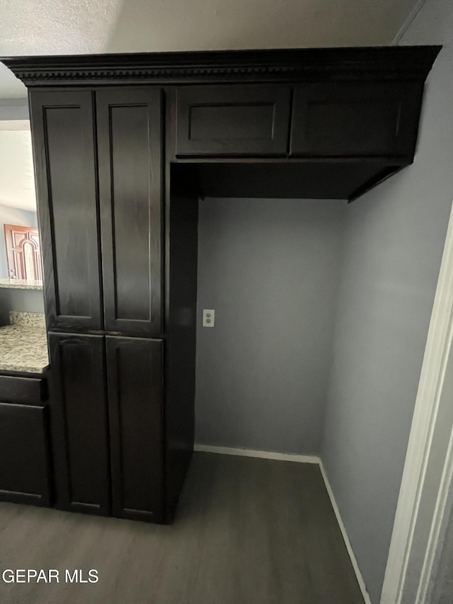 interior space with baseboards and light wood-style flooring