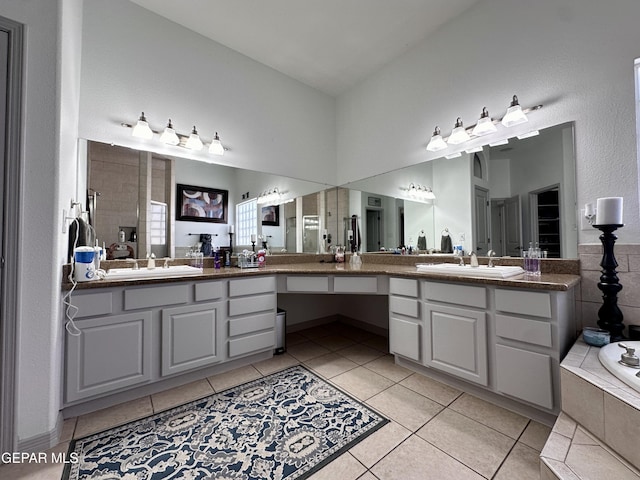 1363 Golden Trail Ln, El Paso, TX 79936 - bathroom with tile patterned flooring, vanity, and a tile shower