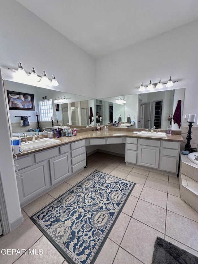 1363 Golden Trail Ln, El Paso, TX 79936 - bathroom featuring tile patterned flooring, two vanities, and a garden tub
