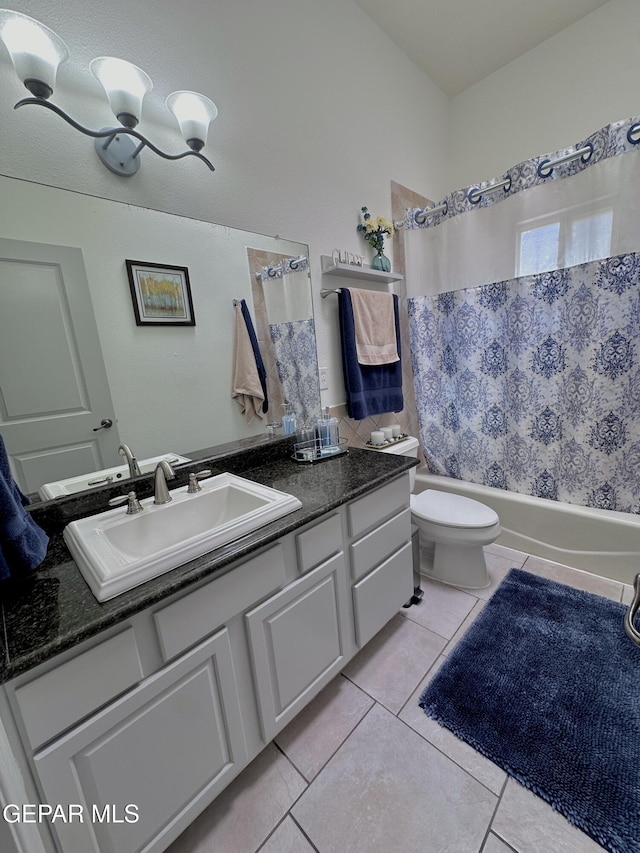 1363 Golden Trail Ln, El Paso, TX 79936 - full bathroom featuring tile patterned flooring, vanity, shower / tub combo with curtain, toilet, and a chandelier