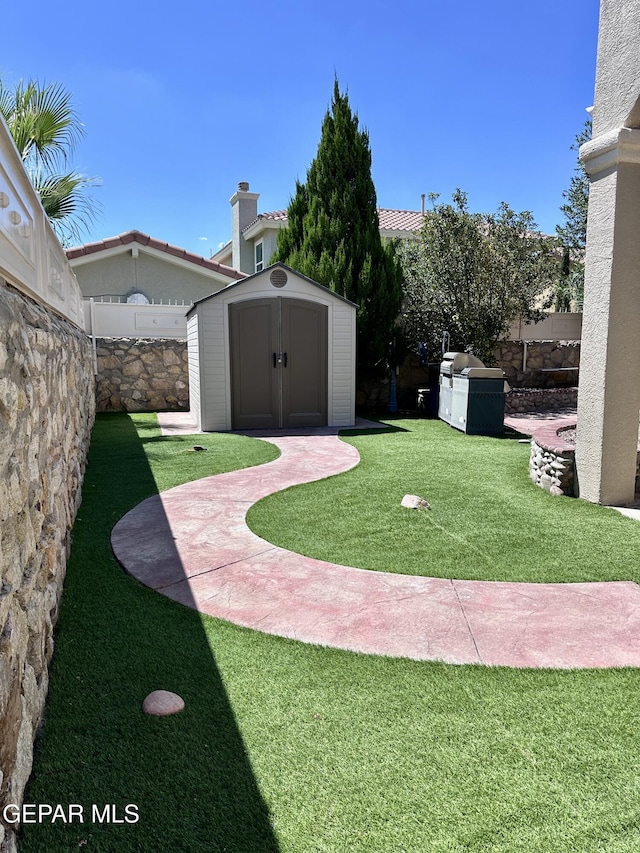 1363 Golden Trail Ln, El Paso, TX 79936 - view of yard with a storage shed and an outdoor structure